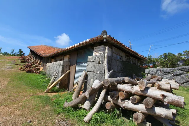 A climbing kiln and stacked firewood at Yachimun no Sato in Yomitan
