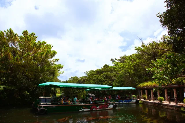 A lake sightseeing boat surrounded by subtropical greenery at Bios Hill